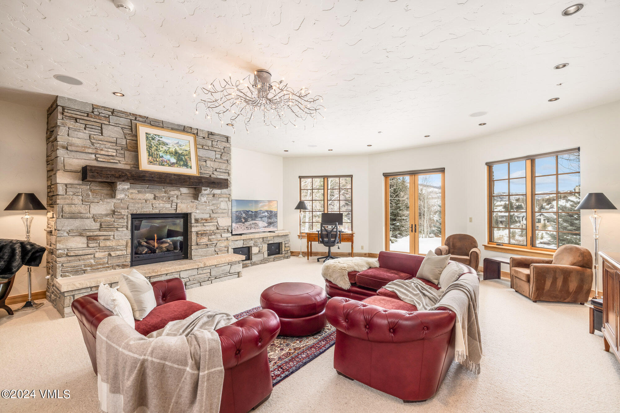 319 Granada Glen Road Edwards, CO 81632 - Photo 25 of 43 a living room with furniture a fireplace and a large window