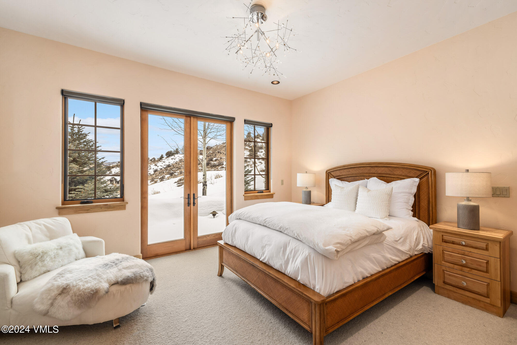 319 Granada Glen Road Edwards, CO 81632 - Photo 31 of 43 a bedroom with a bed and glass window