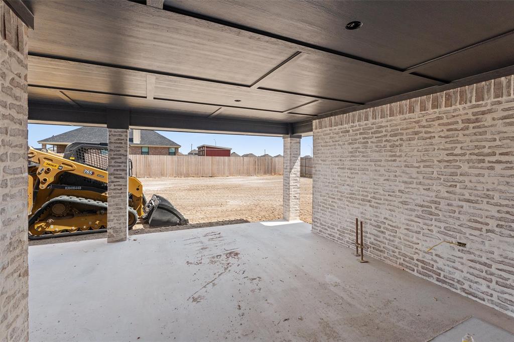 1300 Promised Land Road Hewitt, TX 76643 - Photo 14 of 34 Exposed brick walls, concrete flooring, recessed lighting, and a detailed ceiling panel design