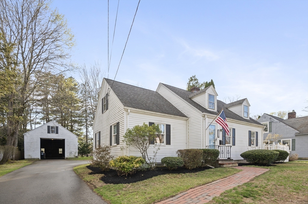 110 Linden Street Hamilton, MA 01982 - Photo 1 of 25 a front view of a house with a yard