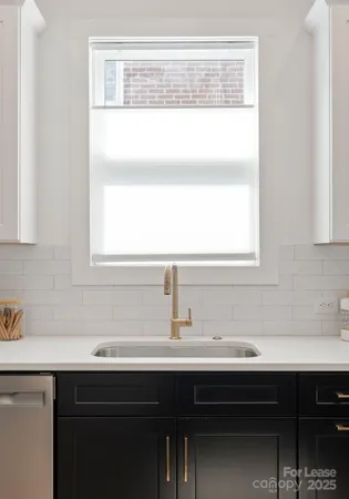 a bathroom with a sink and a window
