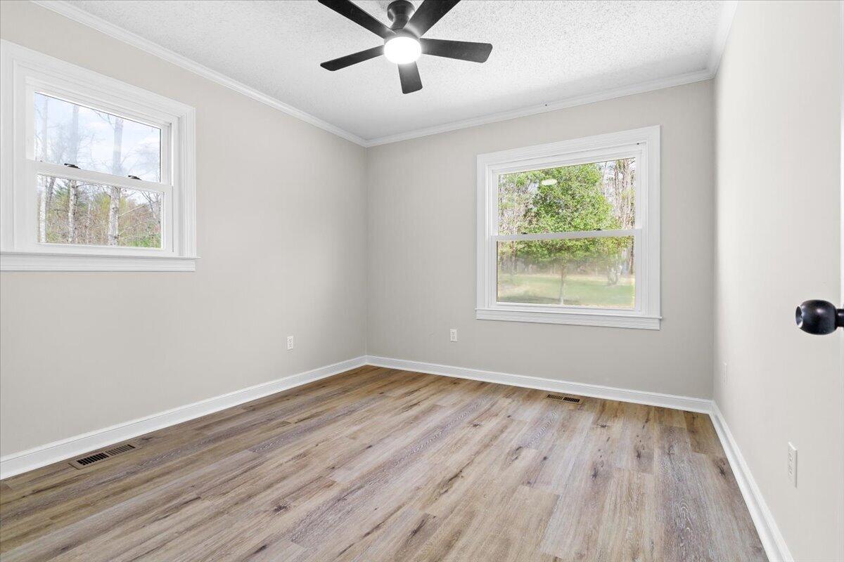 133 Starling Lane Callaway, VA 24067 - Photo 34 of 56 a view of an empty room with wooden floor and a window