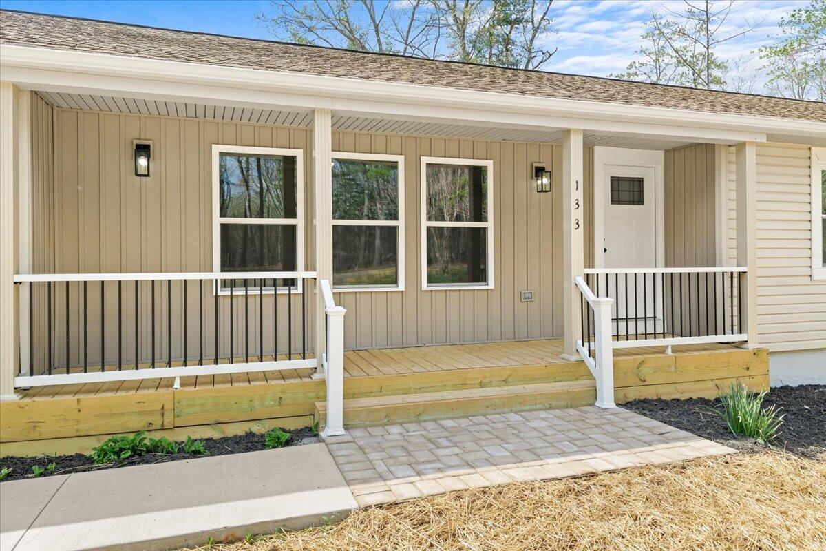 133 Starling Lane Callaway, VA 24067 - Photo 7 of 56 a view of a house with a small yard and wooden floor and fence