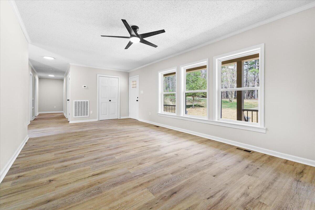 133 Starling Lane Callaway, VA 24067 - Photo 10 of 56 a view of an empty room with a window and wooden floor