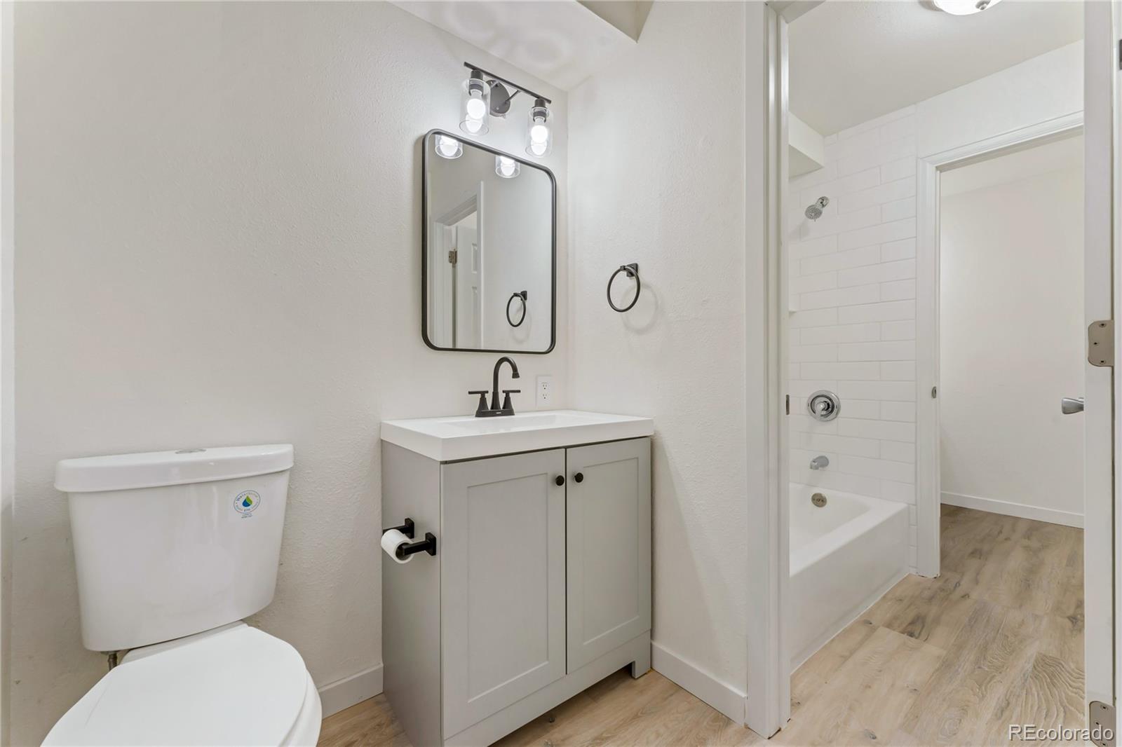 209 East Highline Circle, Unit 108 Centennial, CO 80122 - Photo 12 of 22 a bathroom with a toilet sink and tub