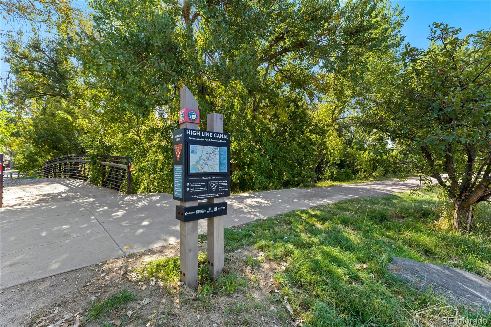 209 East Highline Circle, Unit 108 Centennial, CO 80122 - Photo 19 of 22 a sign board with yard in front of it