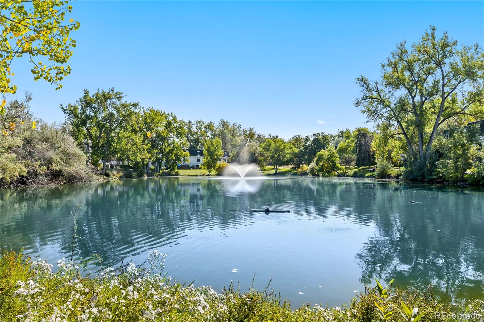 209 East Highline Circle, Unit 108 Centennial, CO 80122 - Photo 20 of 22 a lake view with a lake view