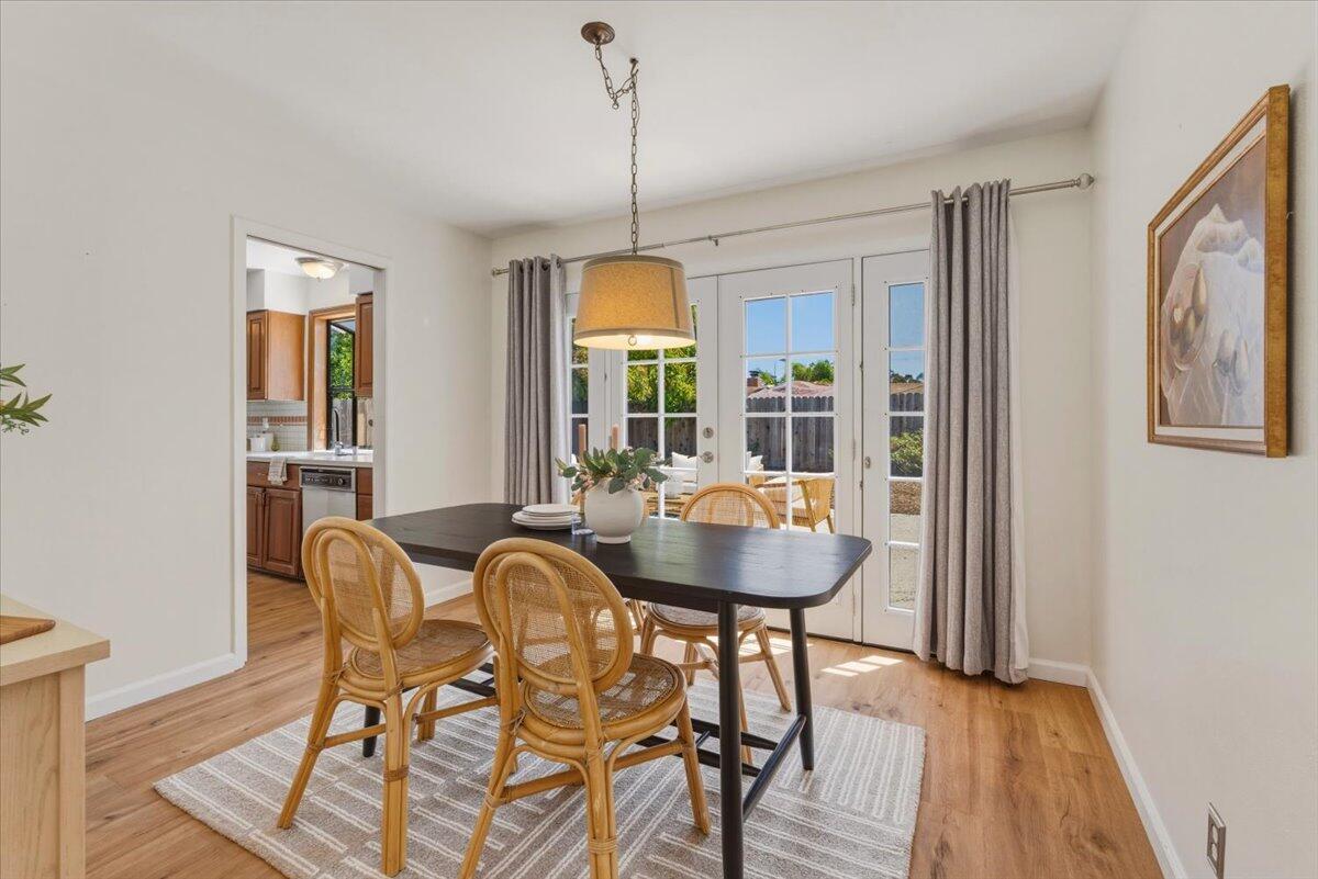 6231 Aberdeen Avenue Goleta, CA 93117 - Photo 2 of 15 a dining room with furniture a chandelier and wooden floor