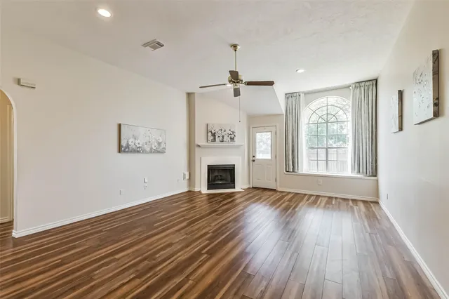 a view of a room with a wooden floor