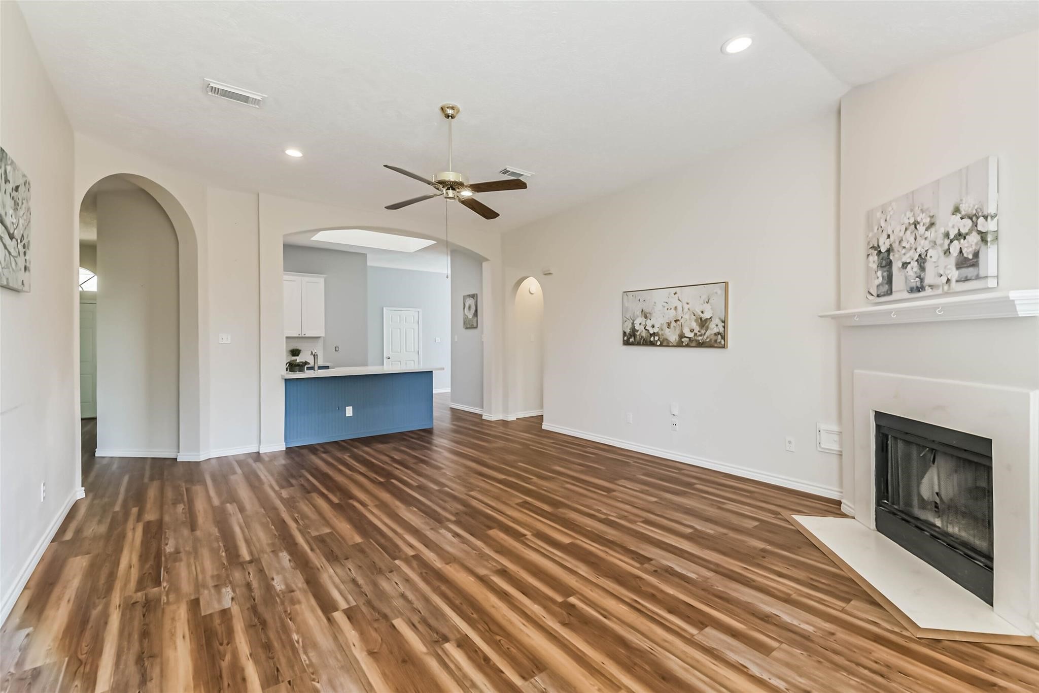15027 Winding Black Cherry Lane Cypress, TX 77433 - Photo 26 of 37 a view of empty room with wooden floor and fireplace