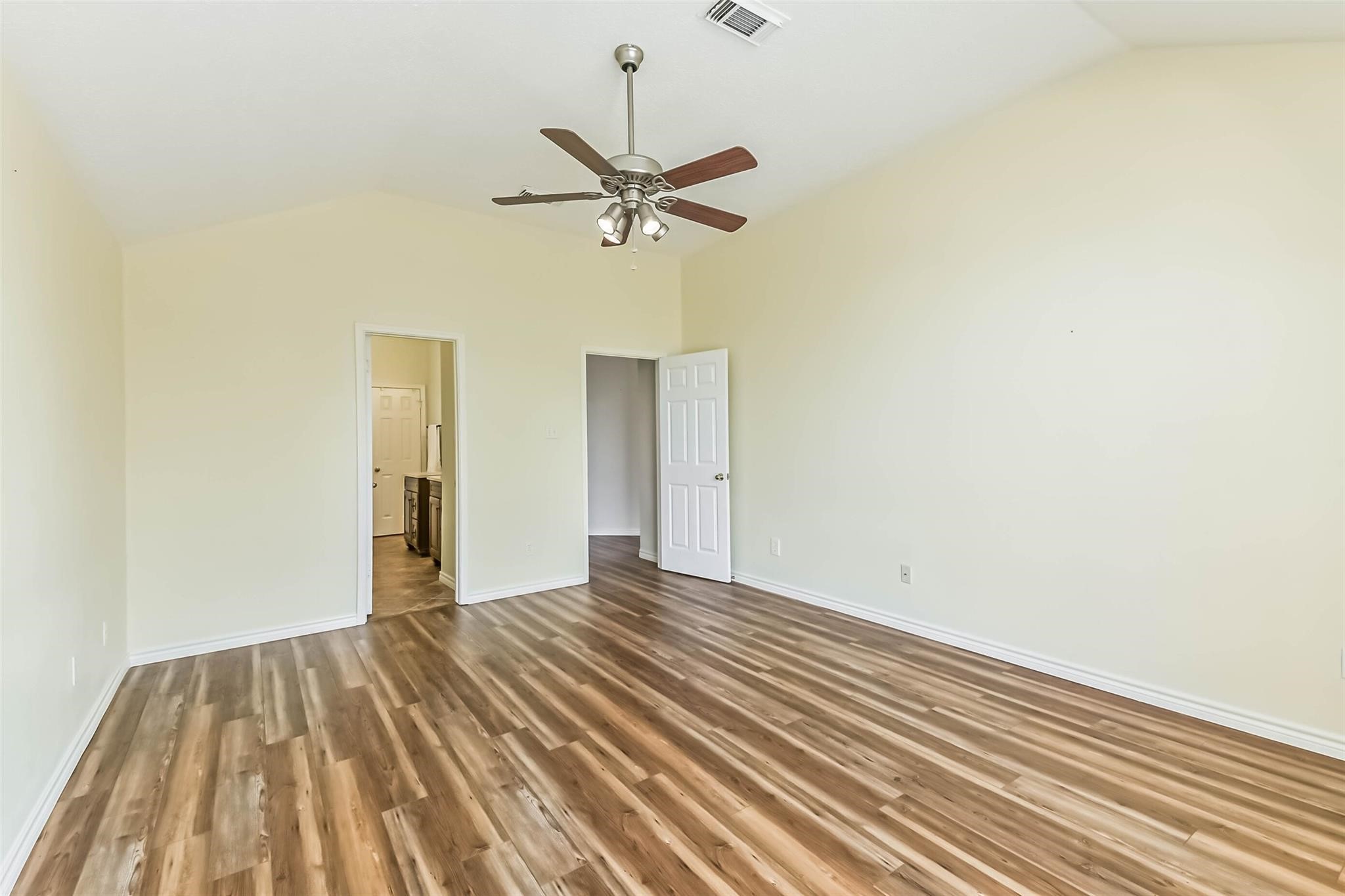 15027 Winding Black Cherry Lane Cypress, TX 77433 - Photo 27 of 37 a view of a room with a wooden floor