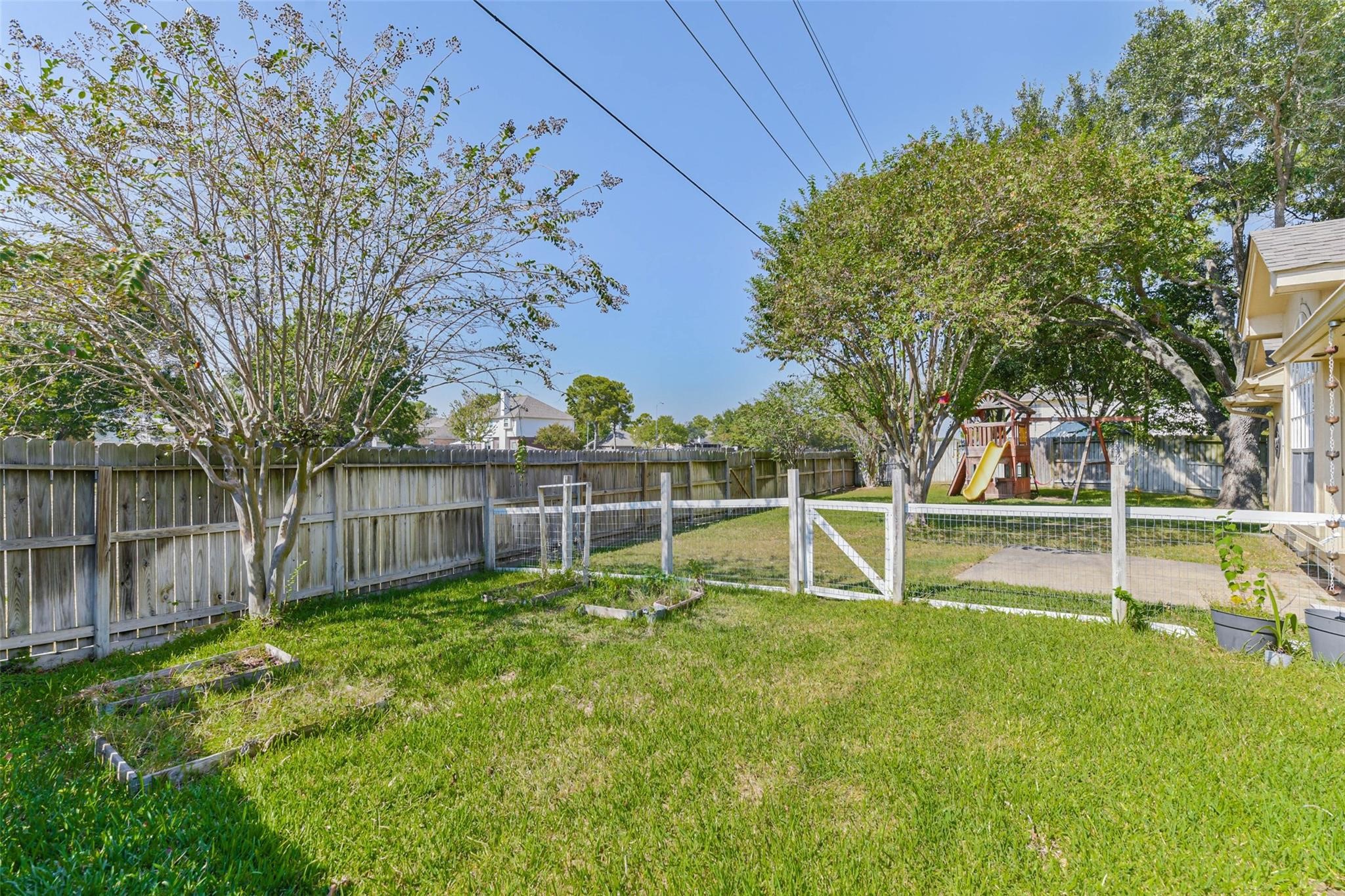 15027 Winding Black Cherry Lane Cypress, TX 77433 - Photo 31 of 37 a view of a backyard with a small cabin