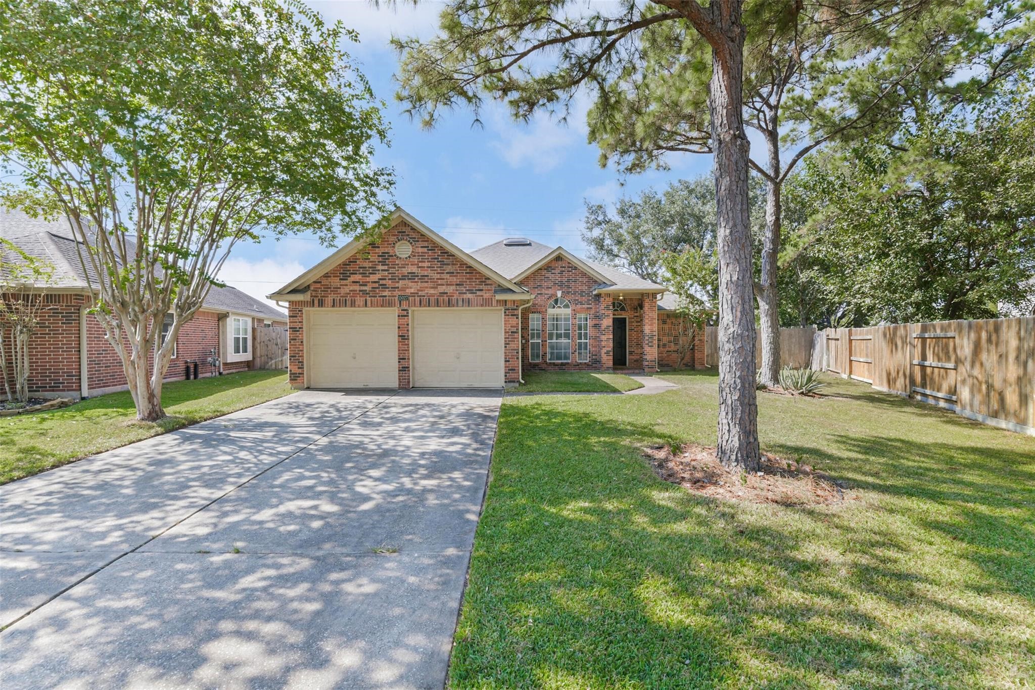 15027 Winding Black Cherry Lane Cypress, TX 77433 - Photo 33 of 37 a view of a house with yard and tree s