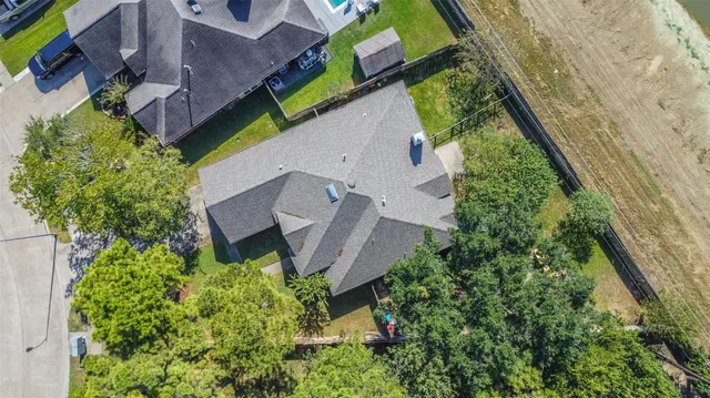 an aerial view of multiple house with outdoor space