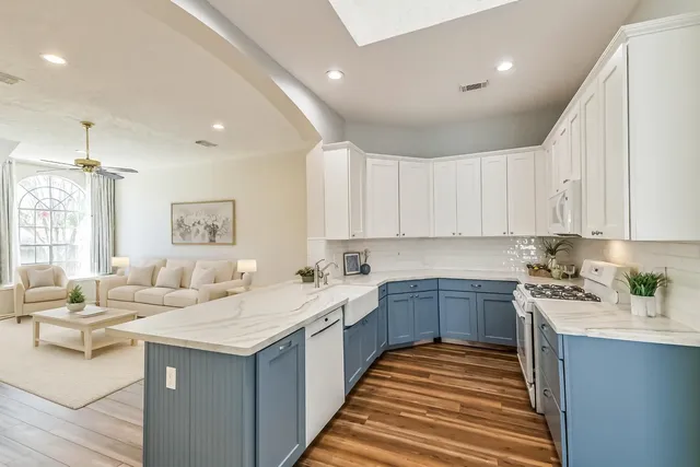 a kitchen with a sink and cabinets