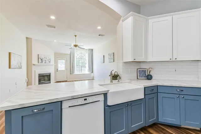 a kitchen with a sink cabinets and window