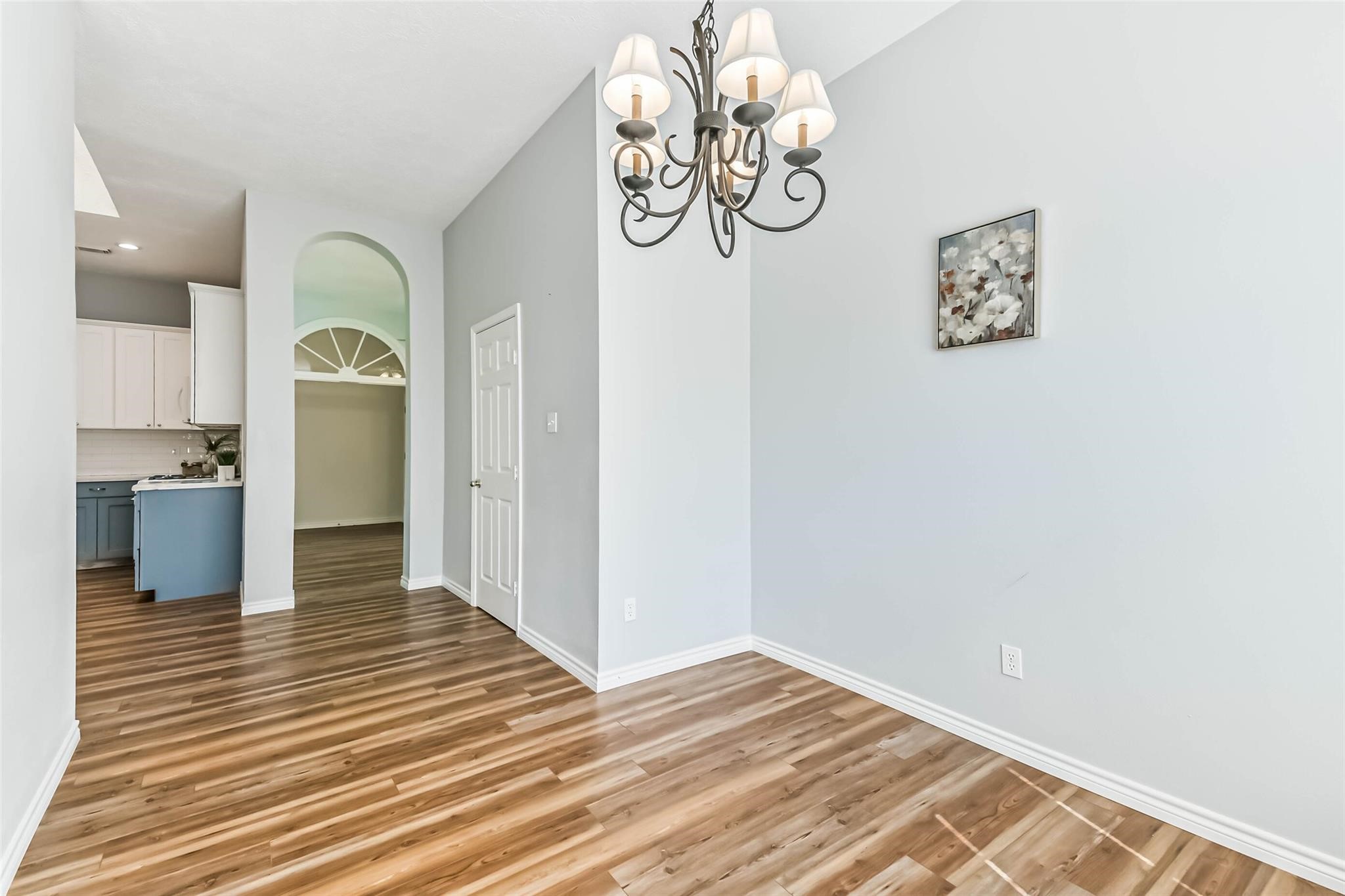 15027 Winding Black Cherry Lane Cypress, TX 77433 - Photo 10 of 37 a view of a hallway with wooden floor