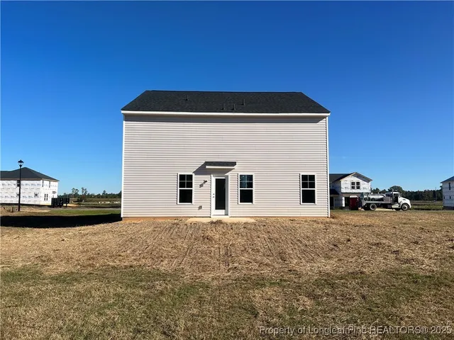 a house with trees in the background