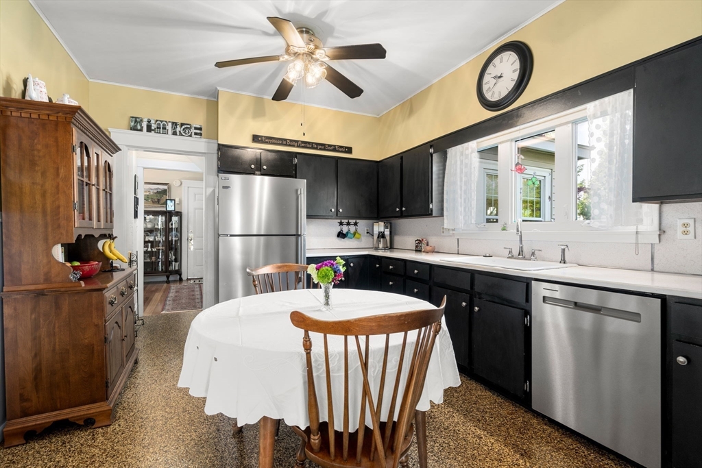 1 Brighton Road Worcester, MA 01606 - Photo 16 of 30 a kitchen with stainless steel appliances granite countertop a sink a stove and a refrigerator