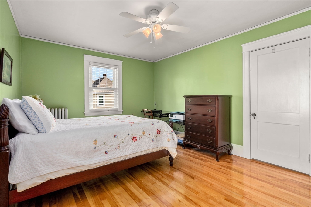 1 Brighton Road Worcester, MA 01606 - Photo 22 of 30 a bedroom with a bed and a chandelier