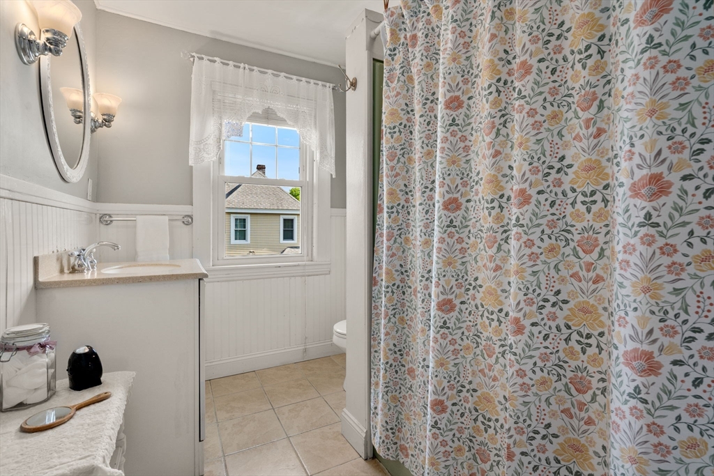 1 Brighton Road Worcester, MA 01606 - Photo 23 of 30 a bathroom with a sink and a mirror