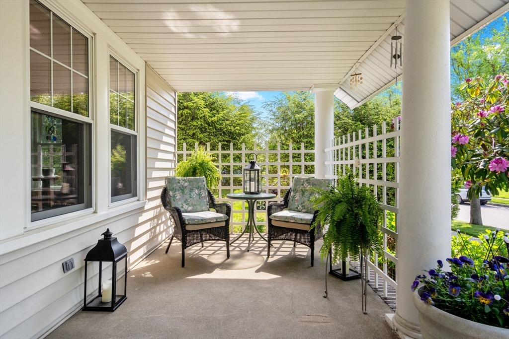 1 Brighton Road Worcester, MA 01606 - Photo 6 of 30 a view of a patio with table and chairs and potted plants