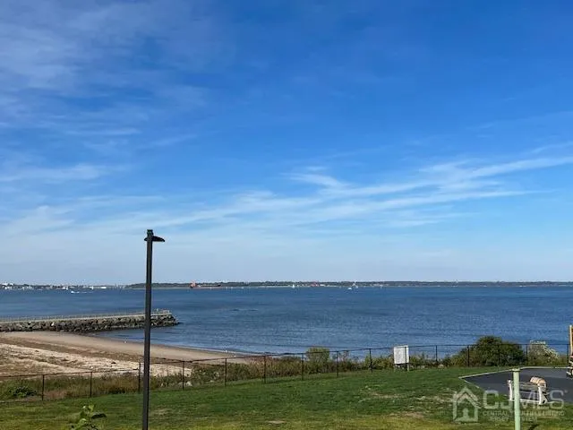 a view of a lake with a big yard