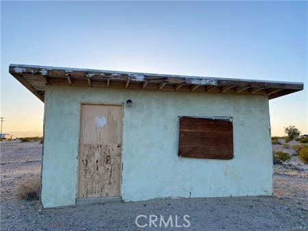 0 Pole Line Road Twentynine Palms, CA 92277 - Photo 6 of 12 a front view of a house with a space
