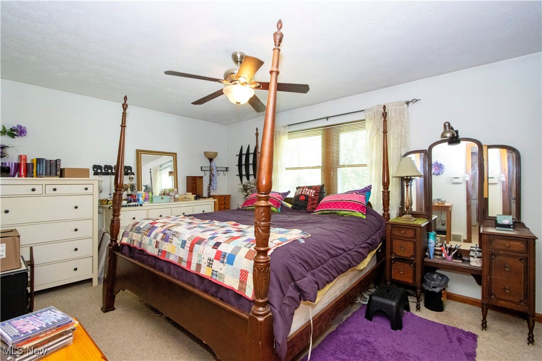 1292 Cinder Road Southeast Carrollton, OH 44615 - Photo 31 of 42 Carpeted bedroom featuring a ceiling fan