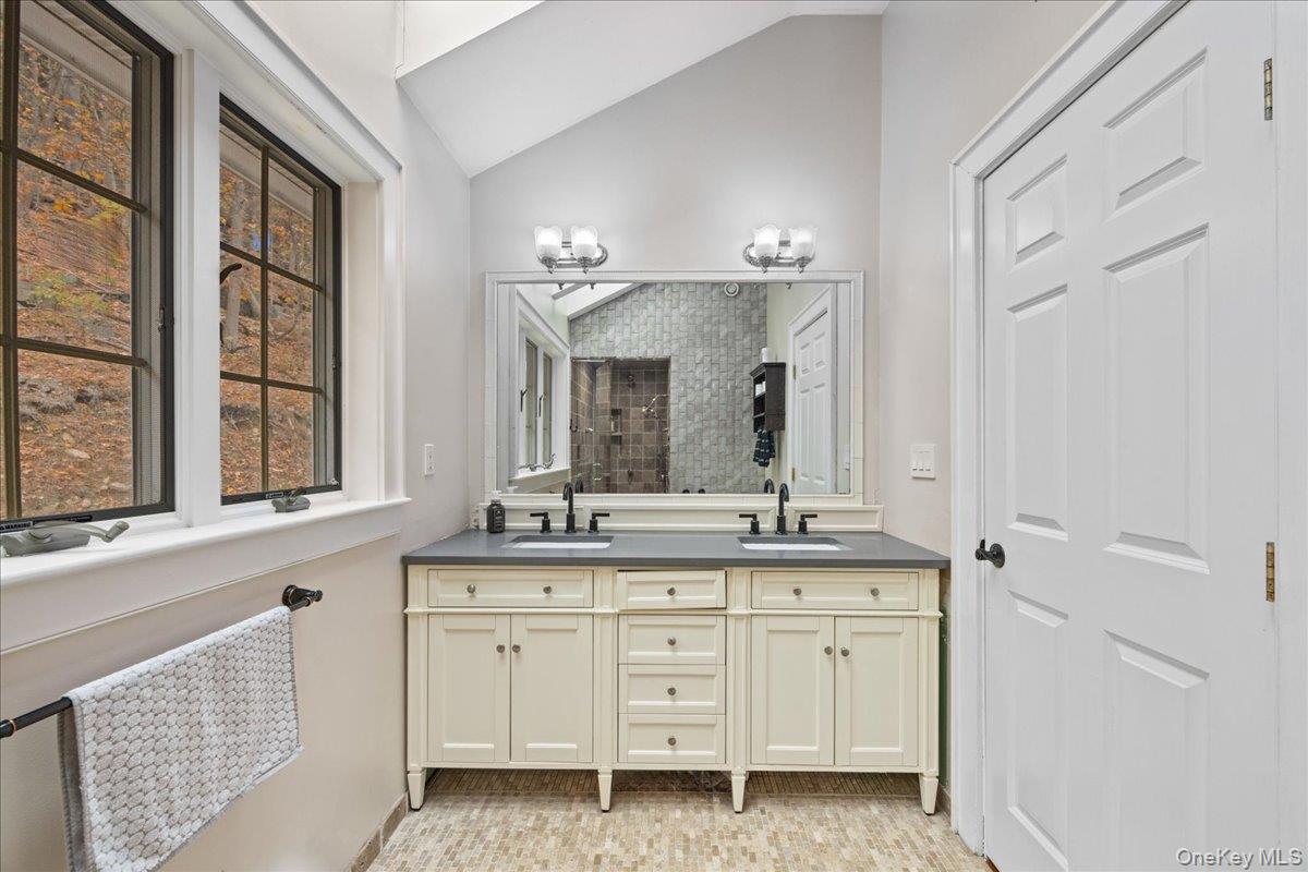 772 Rte 9W Nyack, NY 10960 - Photo 14 of 18 Full bath featuring lofted ceiling, double vanity, and tiled shower