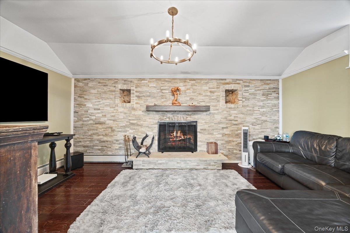 772 Rte 9W Nyack, NY 10960 - Photo 8 of 18 Living area featuring a stone fireplace and chandelier