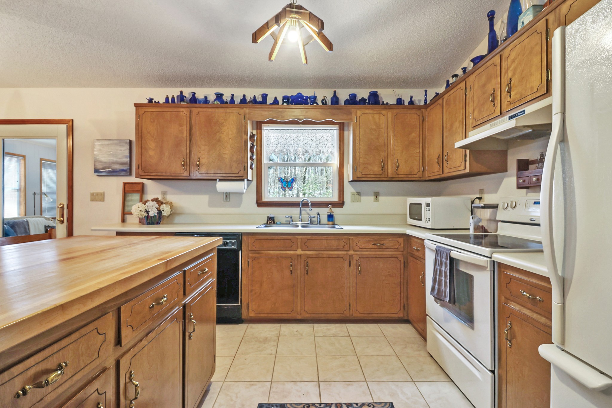 262 Mockingbird Drive Crossville, TN 38555 - Photo 11 of 41 a kitchen with stainless steel appliances a sink window and cabinets