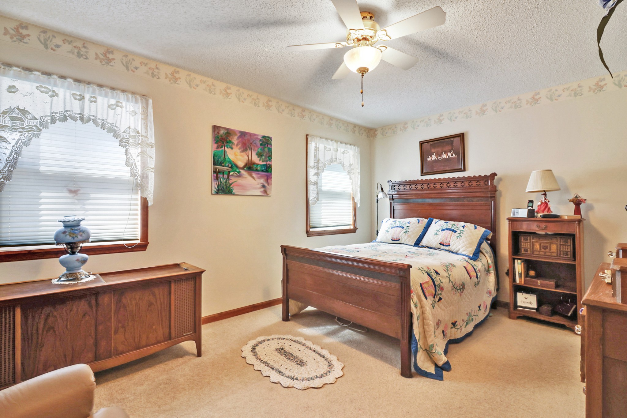 262 Mockingbird Drive Crossville, TN 38555 - Photo 12 of 41 a bedroom with a bed and a chandelier