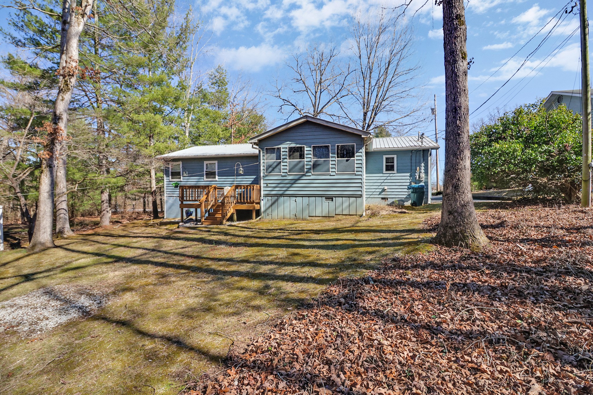 262 Mockingbird Drive Crossville, TN 38555 - Photo 28 of 41 a view of a house with a large tree and a yard