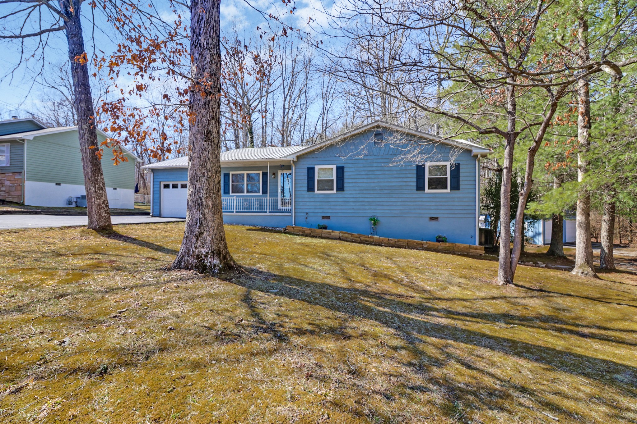 262 Mockingbird Drive Crossville, TN 38555 - Photo 41 of 41 a house view with a trees in front of it