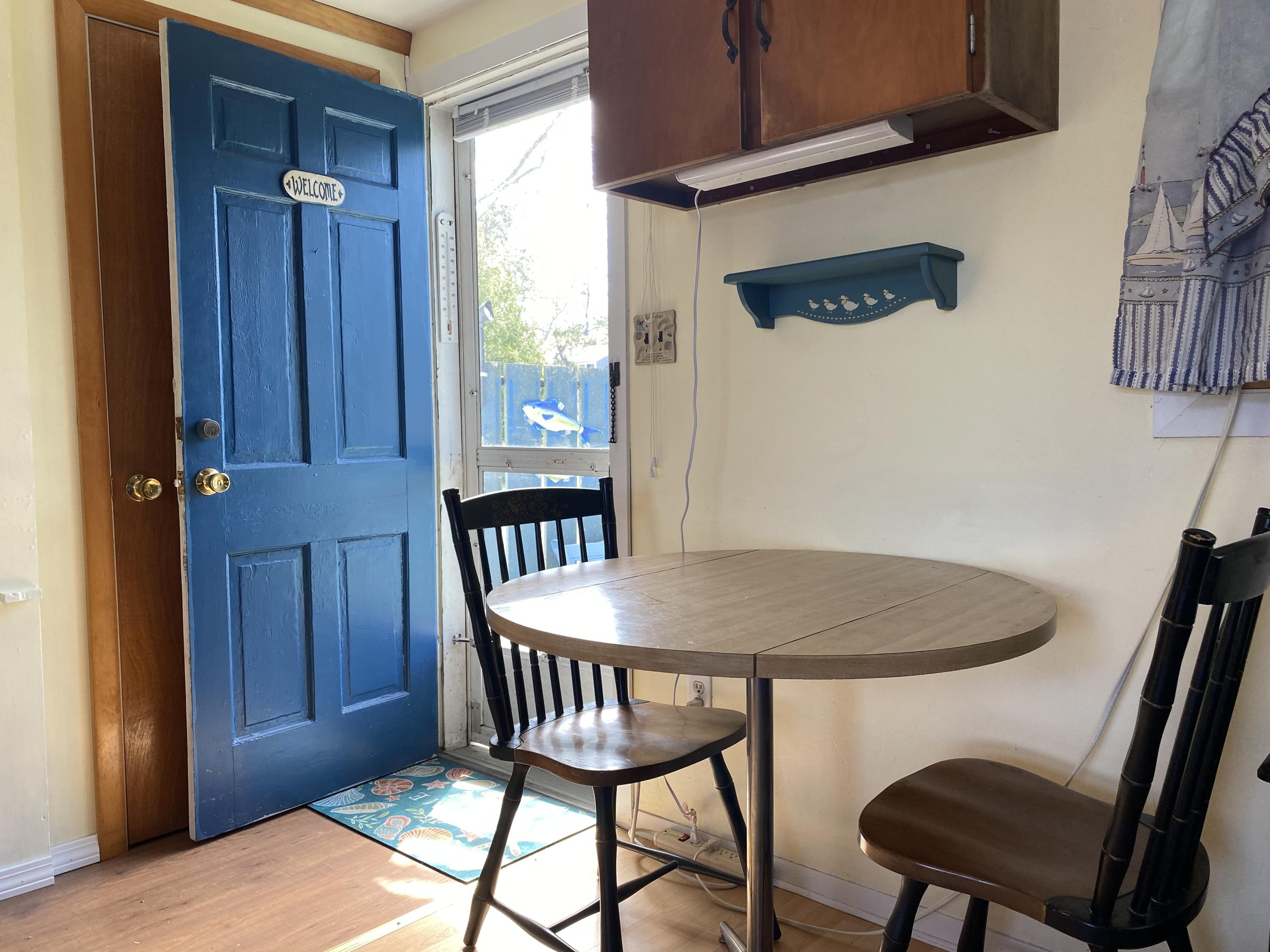 465 Lower County Road, Unit 3A Dennis Port, MA 02639 - Photo 11 of 33 a dining room with furniture and window