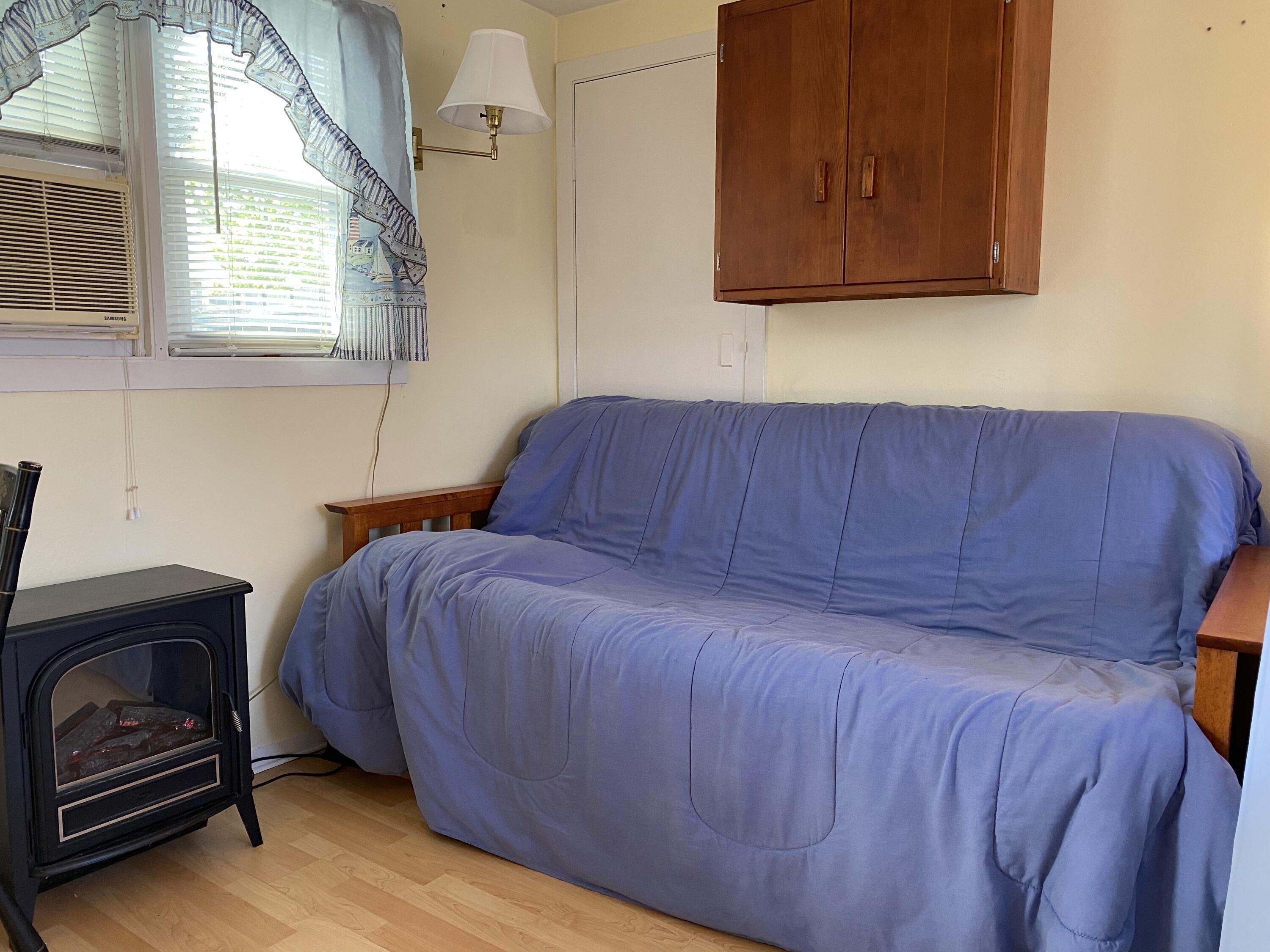 465 Lower County Road, Unit 3A Dennis Port, MA 02639 - Photo 13 of 33 a bedroom with a bed and a window