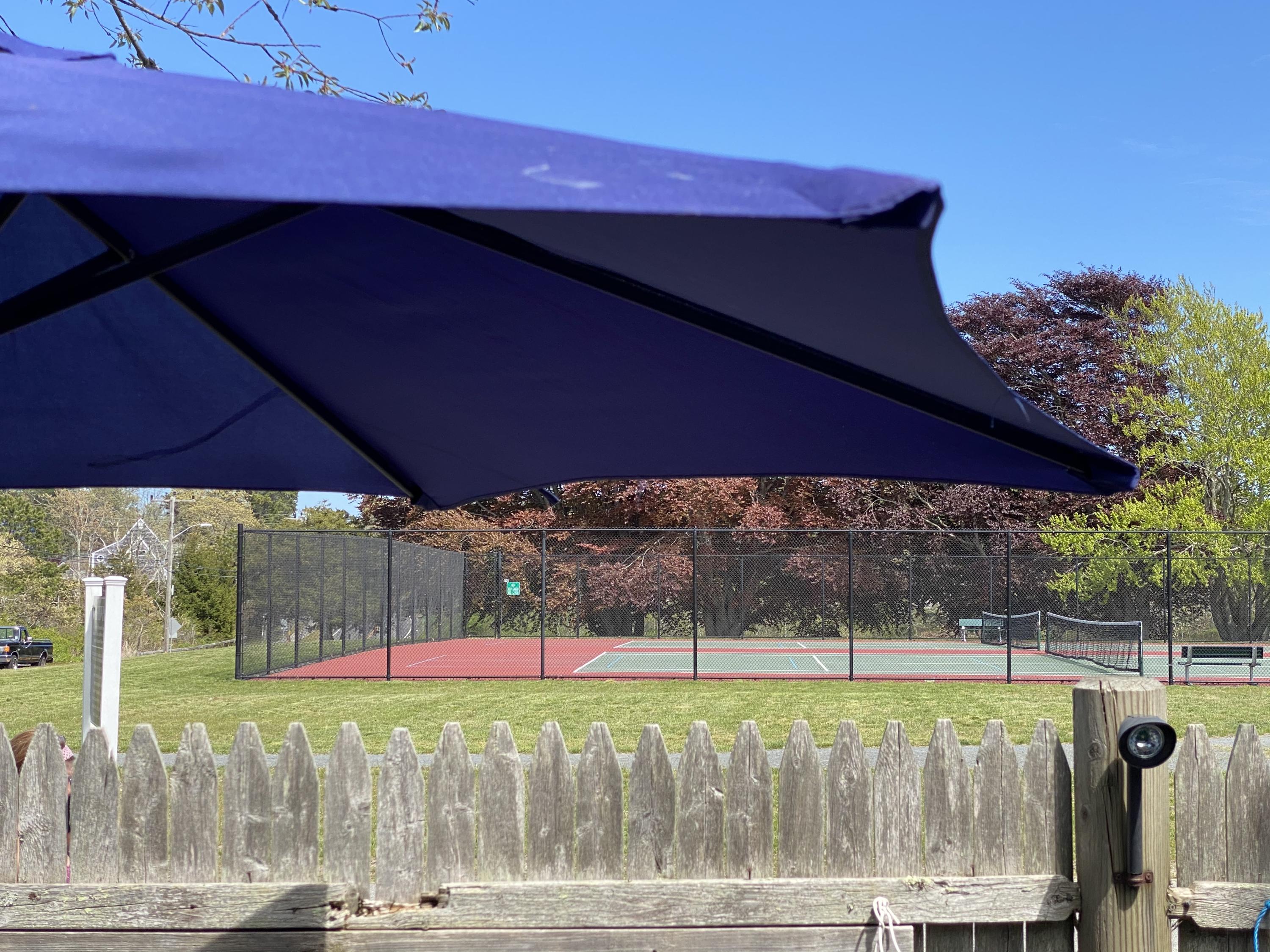 465 Lower County Road, Unit 3A Dennis Port, MA 02639 - Photo 28 of 33 a view of a two tub sitting under an umbrella