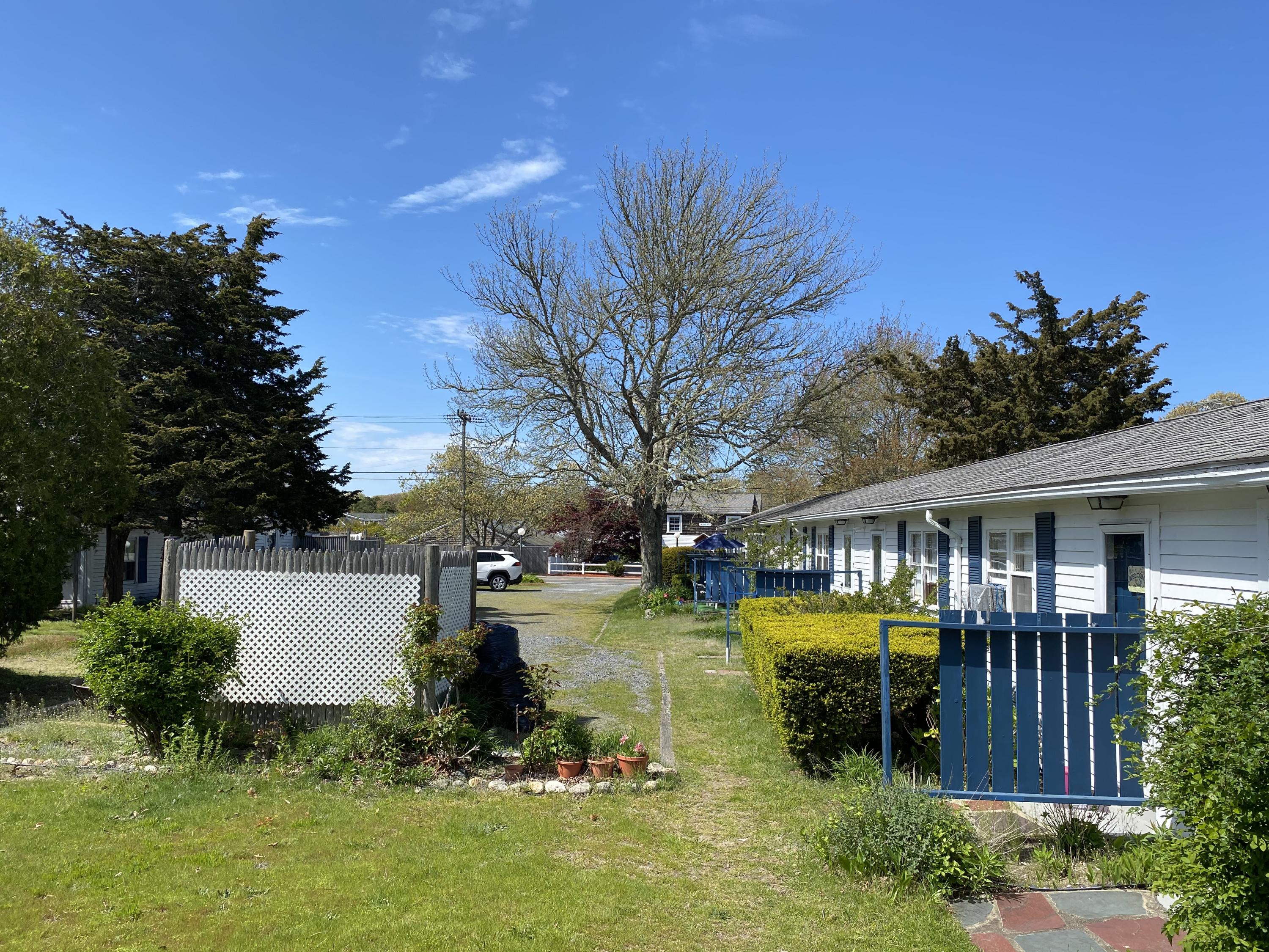 465 Lower County Road, Unit 3A Dennis Port, MA 02639 - Photo 31 of 33 a view of a house with yard and sitting area