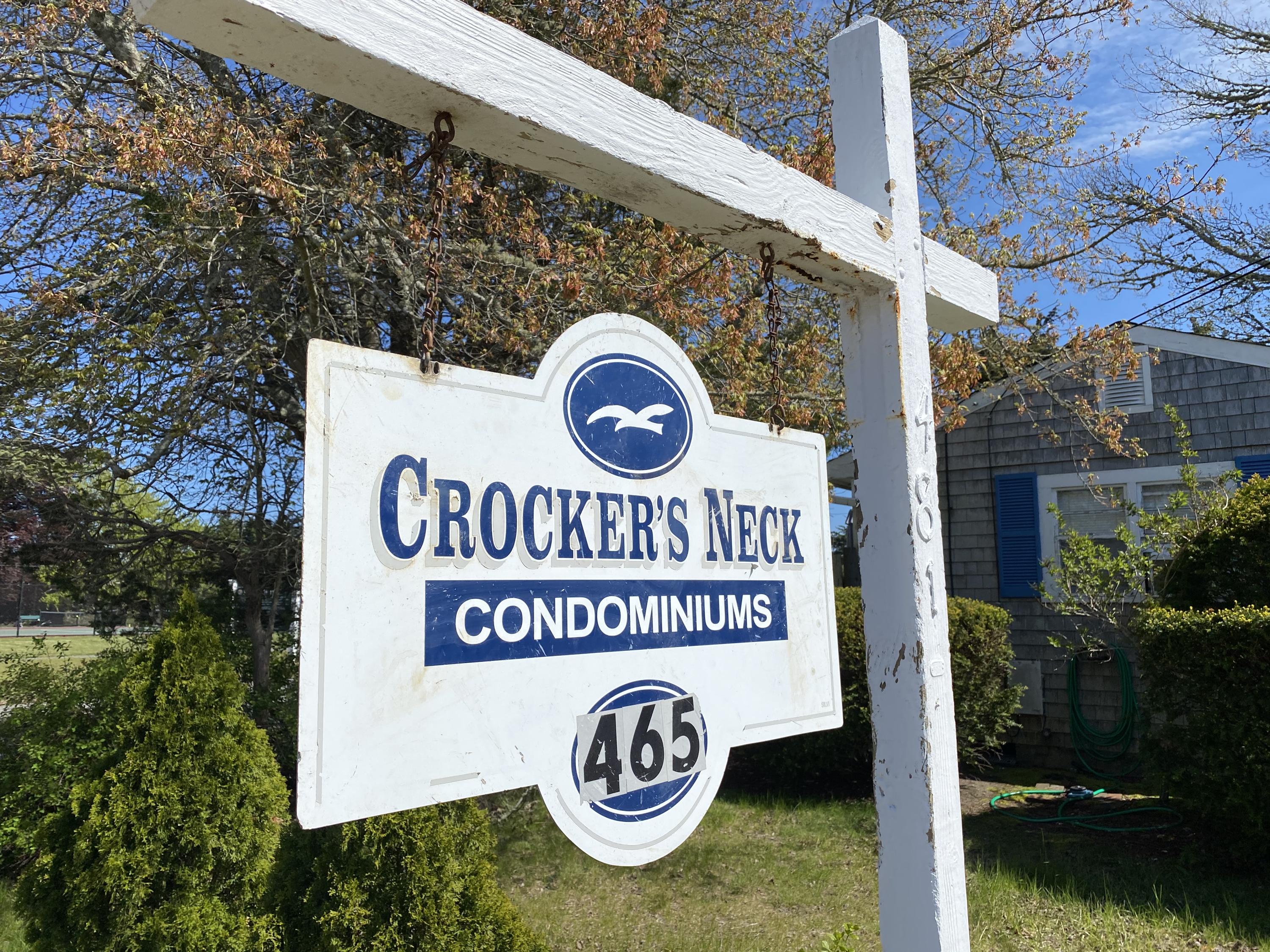 465 Lower County Road, Unit 3A Dennis Port, MA 02639 - Photo 33 of 33 a view of outdoor space with signage and flags
