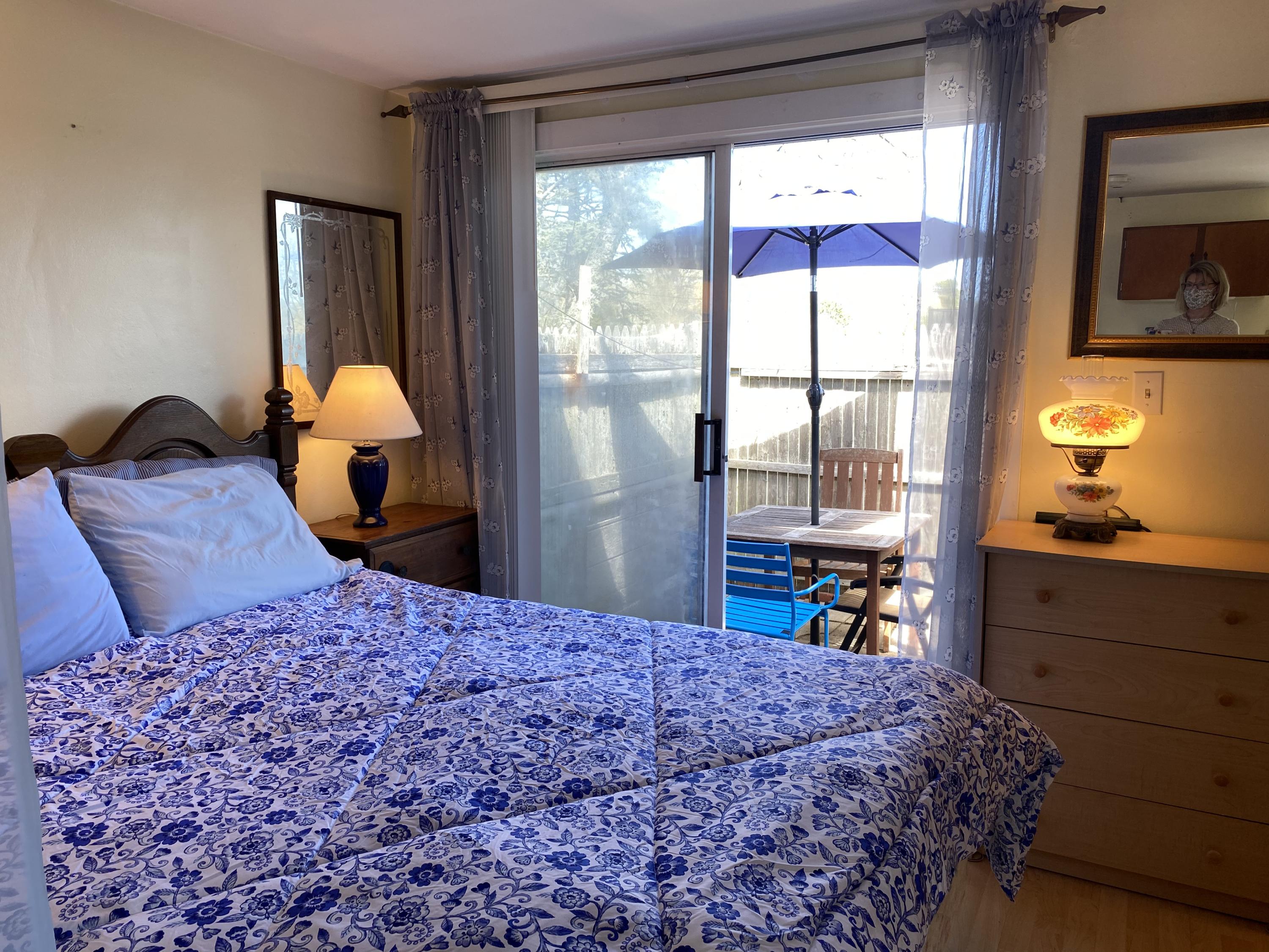 465 Lower County Road, Unit 3A Dennis Port, MA 02639 - Photo 5 of 33 a bed sitting in a bedroom next to a window