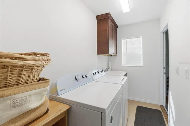a utility room with dryer and washer