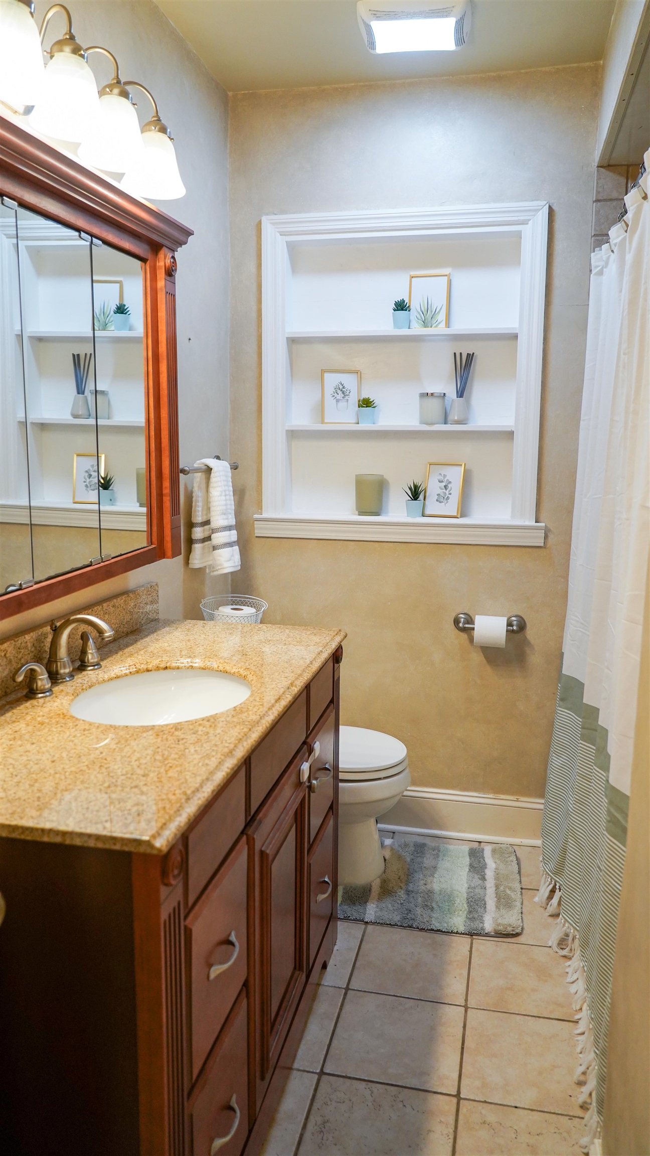 784 Vaughn Road Memphis, TN 38122 - Photo 15 of 28 a bathroom with a granite countertop sink and a toilet