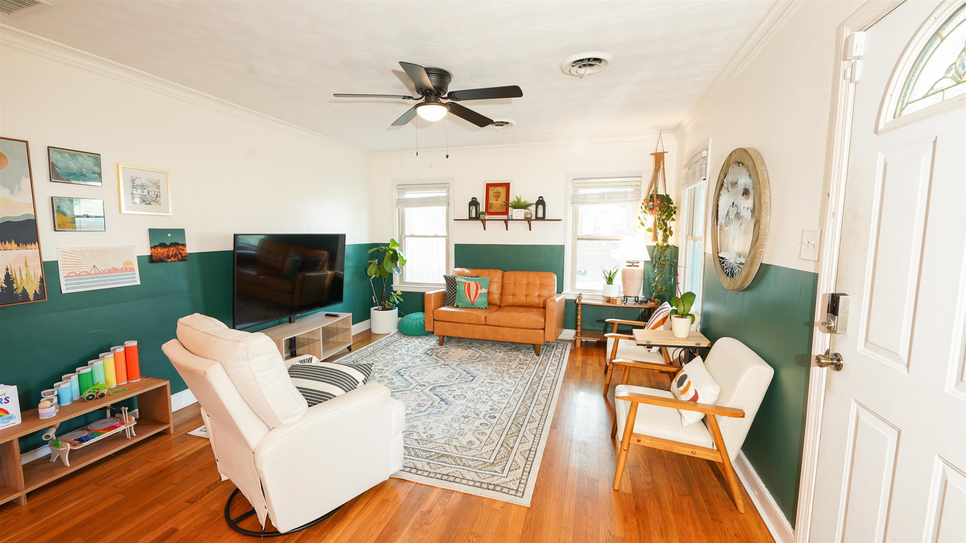 784 Vaughn Road Memphis, TN 38122 - Photo 3 of 28 a living room with furniture a fireplace and a flat screen tv