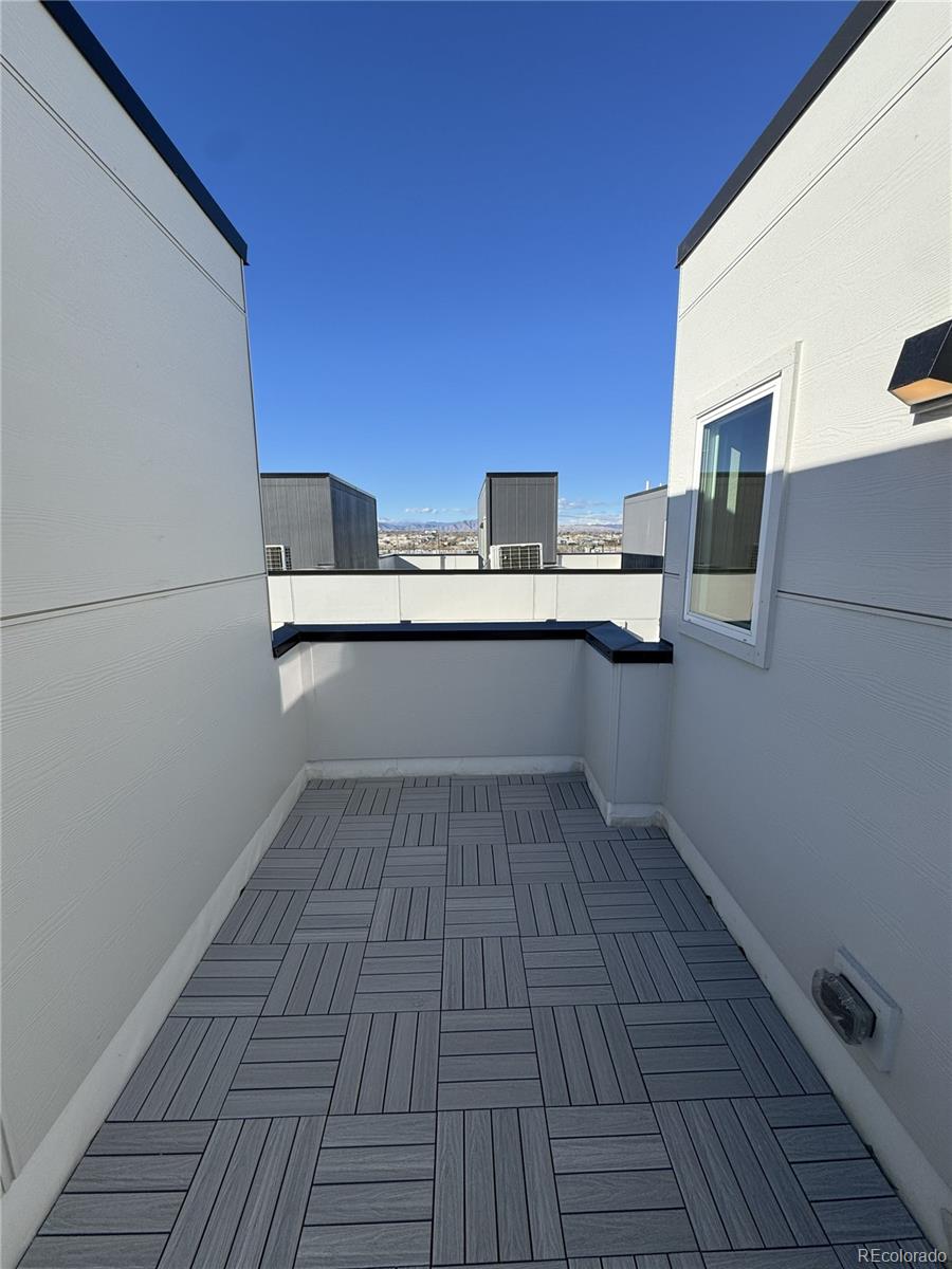 2660 South Delaware Street, Unit 9 Denver, CO 80223 - Photo 18 of 19 a kitchen with a sink and wooden floor