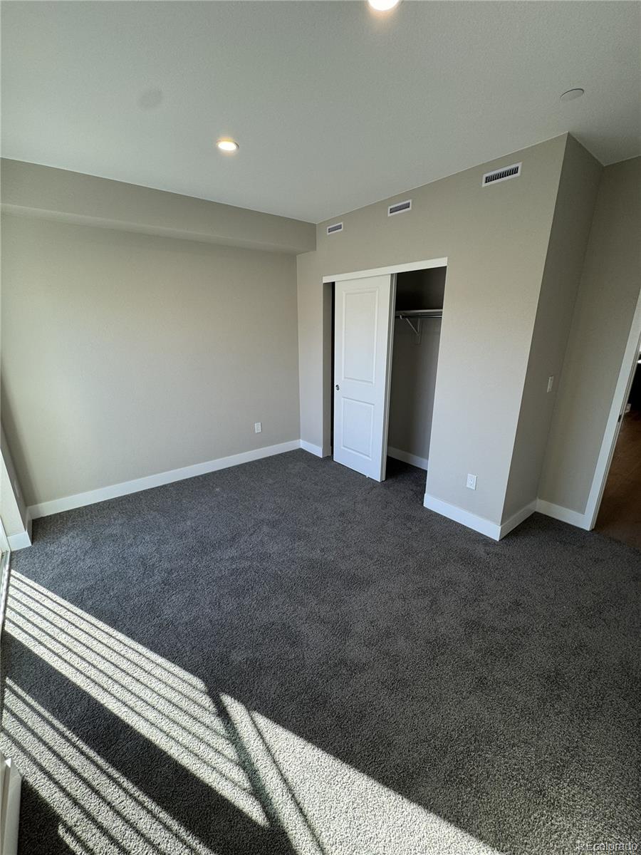 2660 South Delaware Street, Unit 9 Denver, CO 80223 - Photo 5 of 19 a view of an empty room