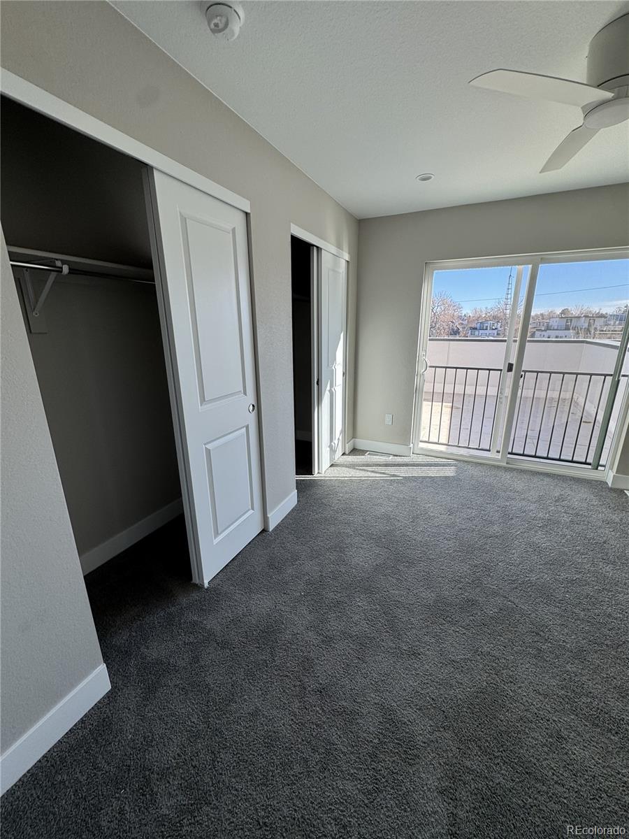 2660 South Delaware Street, Unit 9 Denver, CO 80223 - Photo 7 of 19 an empty room with windows
