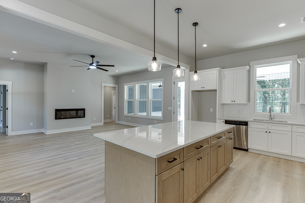 115 Rains Road Jefferson, GA 30549 - Photo 14 of 44 a large white kitchen with a large window