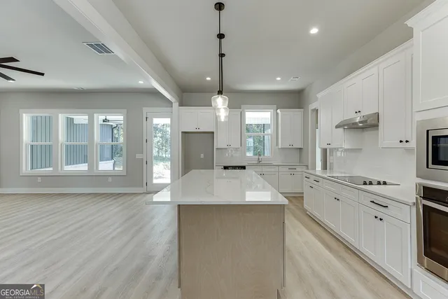 a bathroom with a sink toilet and a mirror