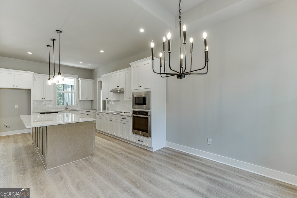 115 Rains Road Jefferson, GA 30549 - Photo 18 of 44 a view of a kitchen and kitchen island